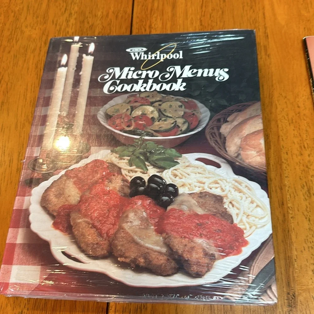 2- Microwave cookbooks. One is still in plastic by Whirlpool. The other Litton